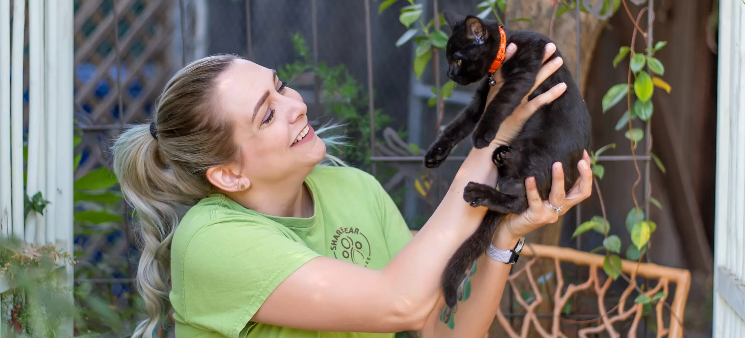 Sharon Graciano holding a black cat